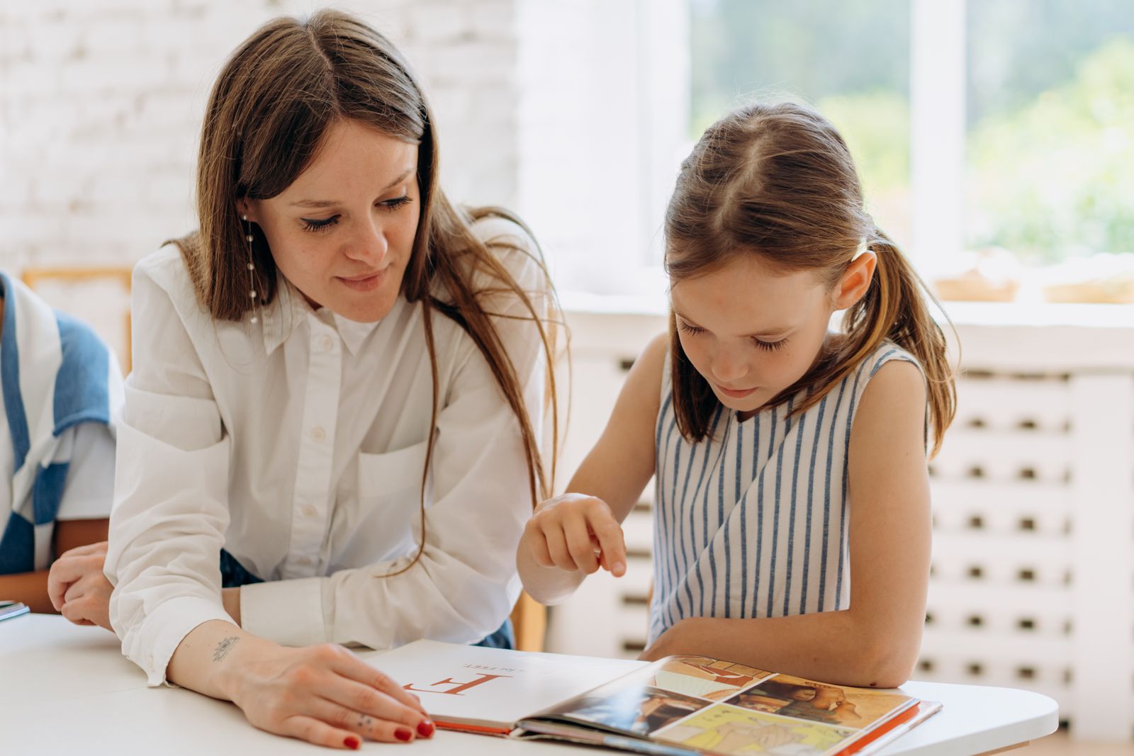 Volunteers helping elementary school students